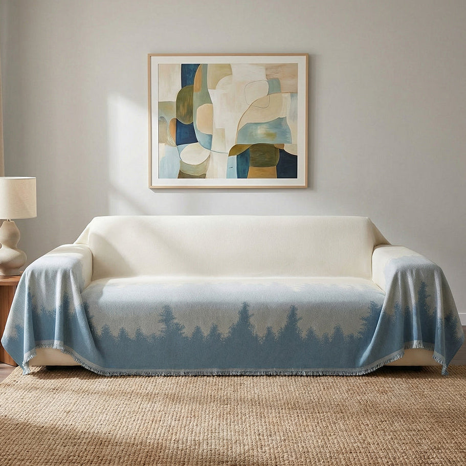 blue and white couch over with trees soft fabric.