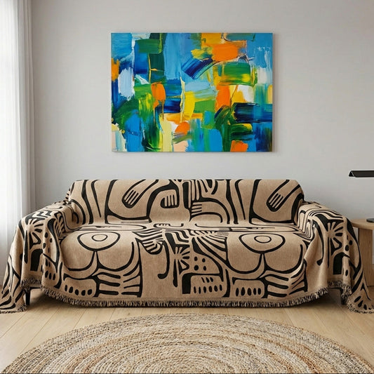 Bold sofa cover in black and brown designed to drape over the entire couch for easy installation.