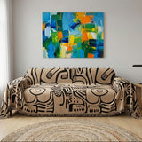 Bold sofa cover in black and brown designed to drape over the entire couch for easy installation.